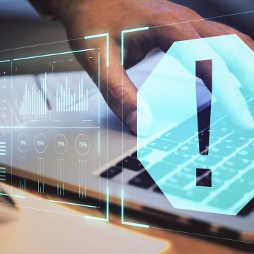 advanced system repair pro safe to use system optimizer hand typing on laptop exclamation point in blue hexagon